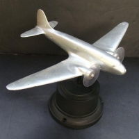 Vintage trench art DC3 or C47 model aircraft on Bakelite stand - Sold for $43
