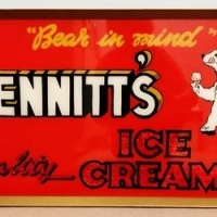 Framed red Sennitt's Ice Cream sign - 'Bear in Mind Sennitt's Ice Cream' - featuring bear, red  foil backing to lower text  - approx 75x35 cm - Sold for $348