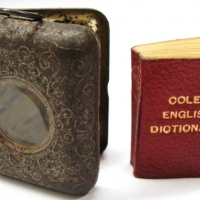 Vintage 'Cole's Book Arcade, Melbourne' miniature English Dictionary (red cover) with metal casependant,  glass to front Approx 3cm x 35cm - Sold for $62 - 2017