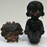 2 x Items - Browning Downing ''Tinka'' wall plaque (chip to rear) & 1950's black ceramic seated boy figure - Sold for $43 - 2017