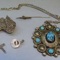 Group lot vintage jewellery incl Silver chain with large pendant featuring scarab, small silver Marcasite cross, stickpin, map of Australian brooch, p - Sold for $50 - 2017