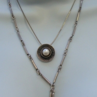 2 x contemporary silver necklaces - long link with two amethyst drops and Pastiche silver chain with disc shaped pendant set with pearl - Sold for $50 - 2017