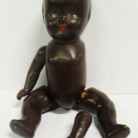 1950's Reliable black composition baby doll - jointed, moulded hair, eyes looking sidewards - 24cms L - Sold for $56 - 2017
