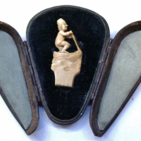 Small antique European ivory carving of a man in a boat in fitted case - Sold for $75 - 2017