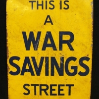 c1930's yellow enamel sign with blue text This is a War Savings street - 27 x 19cms - Sold for $124 - 2017