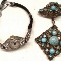 2 x items - 1930s gilt filigree Brooch with suspended pendant set with blue stones & 1950s cocktail watch set with diamantes - Sold for $37 - 2017