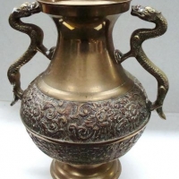 Large brass 2 handled urn with dragon handles and embossed decoration around belly - Sold for $35 - 2017
