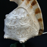 c1910 finely carved trumpet shell lamp featuring  Cameo scene of ladies and putee - Sold for $596 - 2017