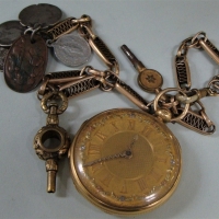 1905 Hallmarked London 18 karat Gold pocket watch wiggly hands and flowers in multi coloured gold on gold plated chain with 2 watch keys and silver co - Sold for $397 - 2017