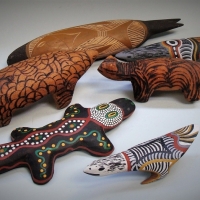 Group of 4 carved Aboriginal spirit totem animals including pokerwork dog - Sold for $27 - 2017