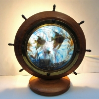 Vintage Kitsch ships wheel Aquarium light with blue xylonite backing - Sold for $112 - 2017