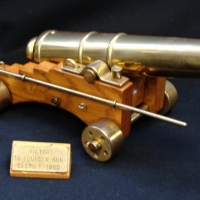 Model Brass canon modeled on 12 pound gun from Nelson ship The Victory 305cm long with ram rod - Sold for $112 - 2017