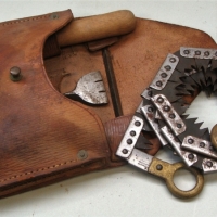 1942 Military flexible saw in leather pouch with saw set & file - Sold for $75 - 2017