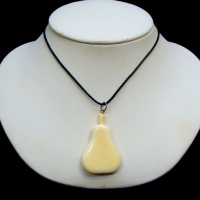 Carved ivory 'Pear' pendant on leather sling - Sold for $25 - 2017