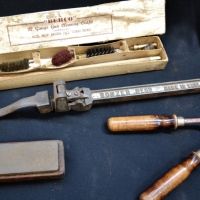 4 x Vintage items incl English made Bonzer metal drum opener, 12 gauge gun cleaning kit, hand shears & sharpening stone - Sold for $25 - 2017