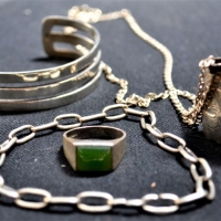 Group lot silver Jewellery incl Wide bangle, oblong locket on long chain, jade ring & chain bracelet - Sold for $31 - 2017