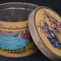 1915 Australian Red Cross tin with Australian & British flags united on the top & Australian flowers - Sold for $137 - 2018