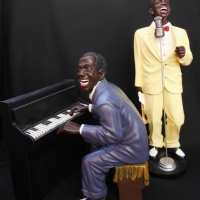 2 x Louis Armstrong 'Satchmo' figurines incl 'singing with his trumpet in hand' & 'playing the piano' - Sold for $174 - 2018