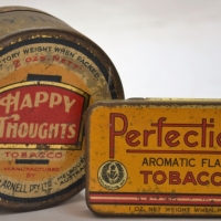 2 x Vintage MELBOURNE made Dudgeon & Arnell TOBACCO Tin - Round HAPPY THOUGHTS 2 Oz + Perfection 1 Oz - Sold for $106 - 2018