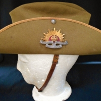 WW2 Dunkerly Akubra Slouch hat with Silver and enameled Rising Sun badge by Stokes and Son and Artillery regiment badge - Sold for $745 - 2018