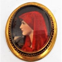 c1890 Gold pinchbeck oval brooch with hand painted portrait of a woman wearing red - Sold for $87 - 2018