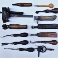 Group of leather working tools including strap cutter, patterning tools, edging tools etc - Sold for $50 - 2018