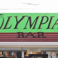 Hand painted 'The Olympians Bar' wooden sign - 40cm x 180cm - Sold for $62 - 2018