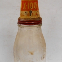 1950s 1 Quart Shell oil bottle with X-100 tin pourer top - Sold for $75 - 2018