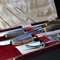 C1950's Boxed English Geo Wostenholm & Son 6 piece carving set with Sterling Silver mounts & carved antler handles - Sold for $93 - 2018