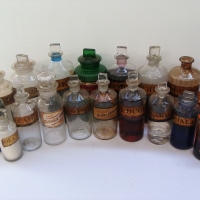 Shelf of Apocathery bottles with Gilt labels and fitted stoppers - Sold for $323 - 2018