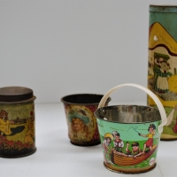 Group of Tins including Gasden money box with children's toys, mouses house Kaleidoscope, and garden and co miniature sand pail - Sold for $37 - 2018
