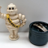2 Items - Reproduction  cast iron Michelin Man and a Royal Doulton tobacco jar - Sold for $68 - 2018