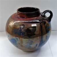 Contemporary Australian Pottery pot with Iridescent overglaze with bird design 20cm tall - Sold for $37 - 2018