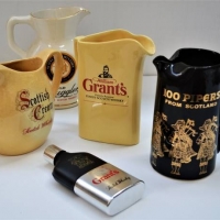 5 x vintage whisky water jugs including Grants, Old Smuggler, Scottish cream and Grants hip flask - Sold for $50 - 2018
