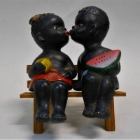 Pair of 1960s cute Kitsch black boy and girl on bench - Sold for $25 - 2018