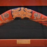 Box Framed Australian Aboriginal boomerang (75cm long) with dot painted Bush Myths decoration by Teddy 1991 'Sacred Heart Dreaming - Sold for $62 - 2018