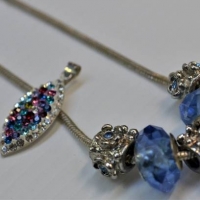 Group lot silver jewellery - Pandora style necklace with blue stone charms & Swarovski style crystal pendant with bright coloured stones - Sold for $27 - 2018