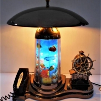A kitsch all-in-one desk piece with telephone, music box, light, etc - Sold for $37 - 2018