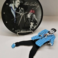 2 x Elvis clocks incl swinging legs pendulum - Sold for $31 - 2018