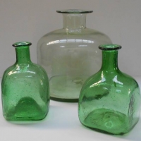 3 x pieces green art glass bottles incl large Scandinavian dome shaped and pair of 'Patron' embossed bottles - Sold for $25 - 2018