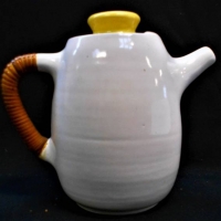 1950s Australian pottery Coffee pot by Allan Lowe in white glaze with yellow lid with cane wrapped handle 19cm tall - Sold for $56 - 2018