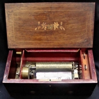c1900 Coromandel and Rosewood Mechanical Music box with ratchet wind up Swiss movement - damage to lid - Sold for $261 - 2018