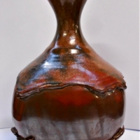 Large 1970s Reg Preston Australian pottery Vase, tomato red glaze, impressed monogram to base   - 37cm tall - Sold for $161 - 2018
