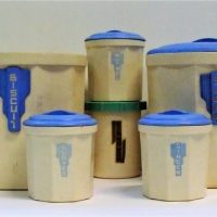 Group of white  Bakelite cannisters including spice cannisters with blue and green lids - Sold for $37 - 2018