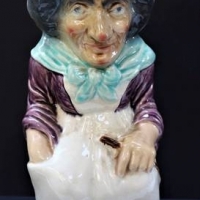 19thc French Sarreguemines female Toby jug wearing a bonnet with pink ribbon - 30cm tall - Sold for $25 - 2018