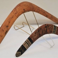 2 x Boomerangs 1960s Perth with stingray hunting scene and 1950s Pokerwork boomerang with pokerwork Kangaroos Goanna and snake - Sold for $37 - 2018