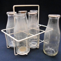 6 x Vintage Milk Bottles in carrier including Bellet & Cook Camberwell, Nirvana Dairy East Malvern, Select Dairy Surrey Hills and Model Dairy Kew - Sold for $87 - 2018