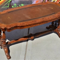 Leather inlaid Walnut Veneered table with ornate turnings - Sold for $43 - 2018