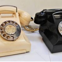 2 x Bakelite rotary dial telephones - cream and black - one with enamel dial - Sold for $137 - 2018