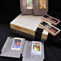 Group with NES Nintendo Entertainment System Console and games including Rainbow island, A Boy and his blob, and Alpha Mission - Sold for $62 - 2018